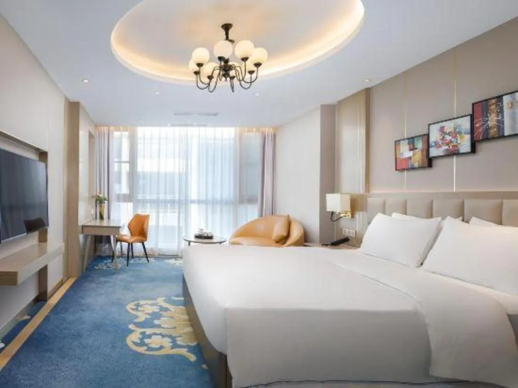 Bed in Vienna Hotel Yunnan Maitreya Huquan