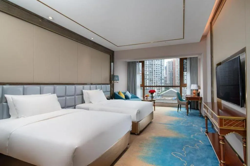 Bed in Vienna Hotel Yunnan Maitreya Huquan