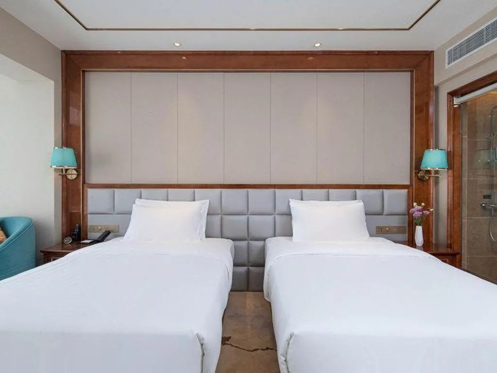 Bed in Vienna Hotel Yunnan Maitreya Huquan