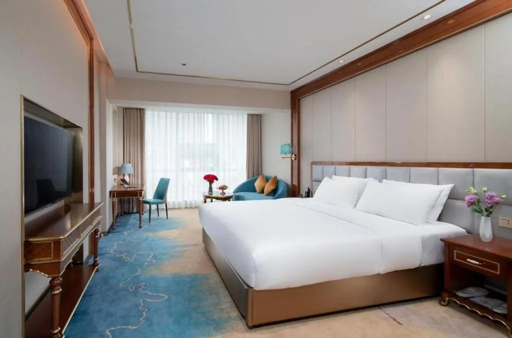 Bed in Vienna Hotel Yunnan Maitreya Huquan