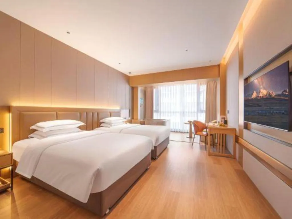 Bed in Vienna Hotel Yunnan Maitreya Huquan