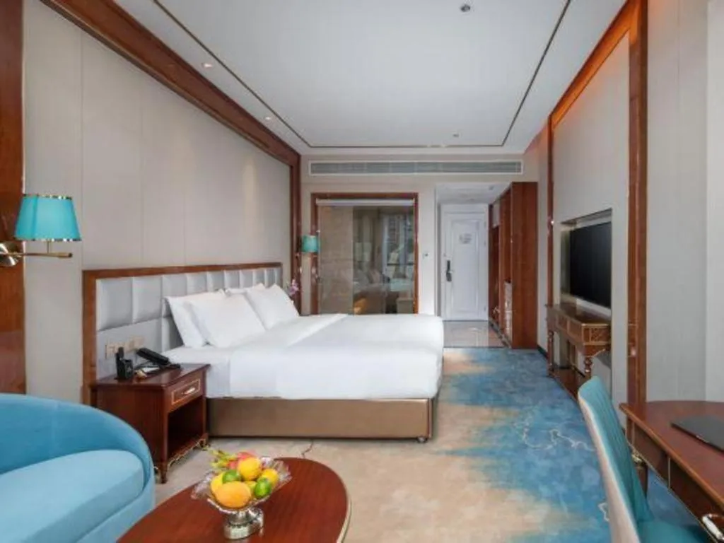 Bed in Vienna Hotel Yunnan Maitreya Huquan