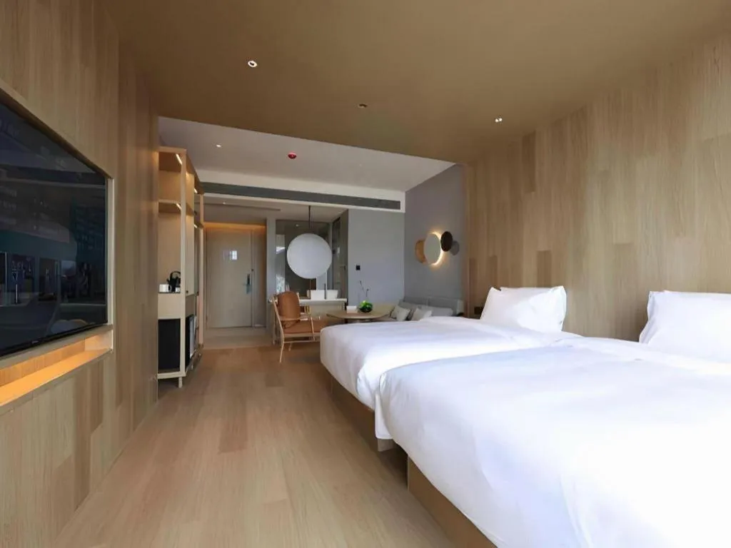 Bed in Vienna Hotel Yunnan Maitreya Huquan