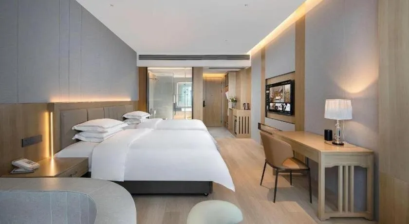 Bed in Vienna Hotel Yunnan Maitreya Huquan