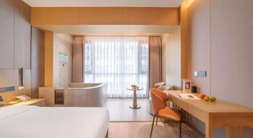 Bed in Vienna Hotel Yunnan Maitreya Huquan