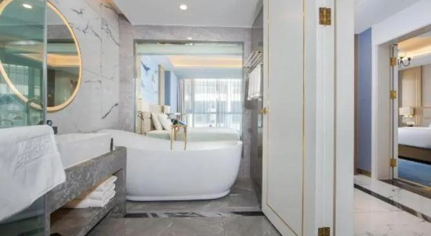 Bed in Vienna Hotel Yunnan Maitreya Huquan