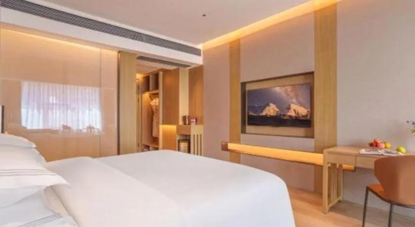 Bed in Vienna Hotel Yunnan Maitreya Huquan