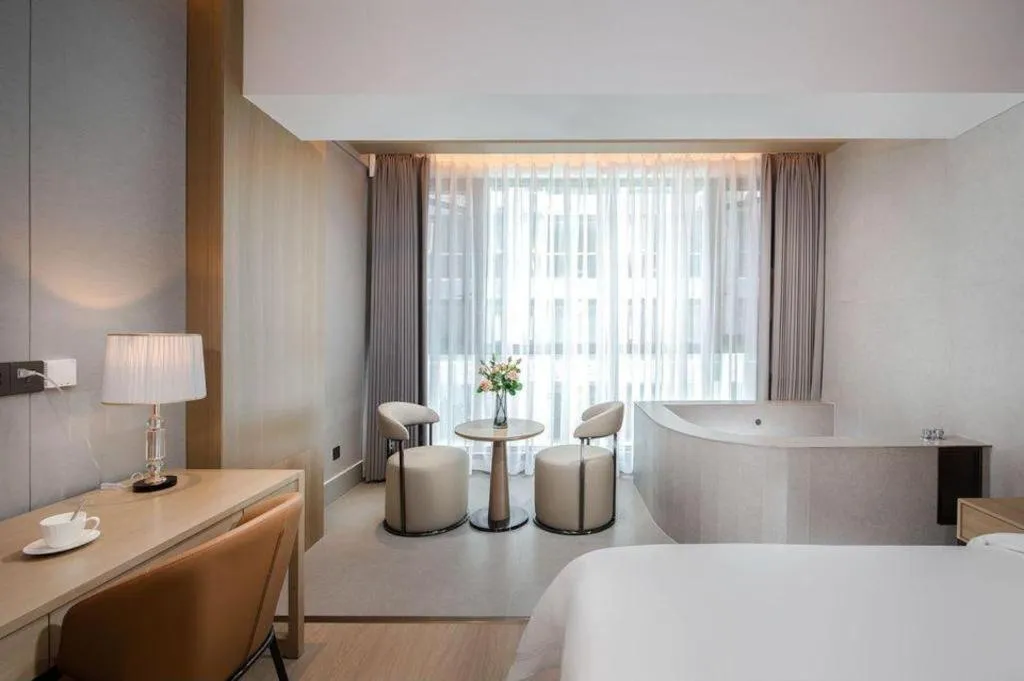 Bed in Vienna Hotel Yunnan Maitreya Huquan