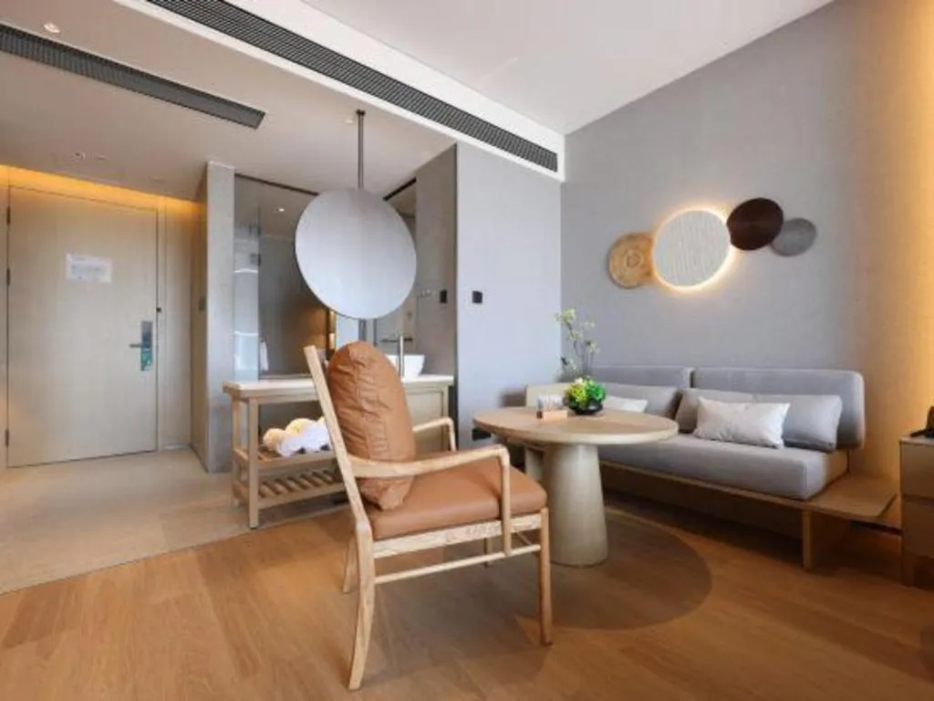 Bed in Vienna Hotel Yunnan Maitreya Huquan