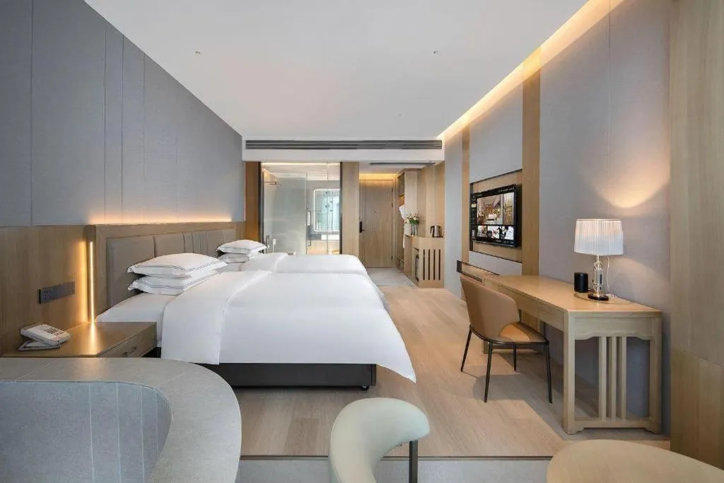 Bed in Vienna Hotel Yunnan Maitreya Huquan