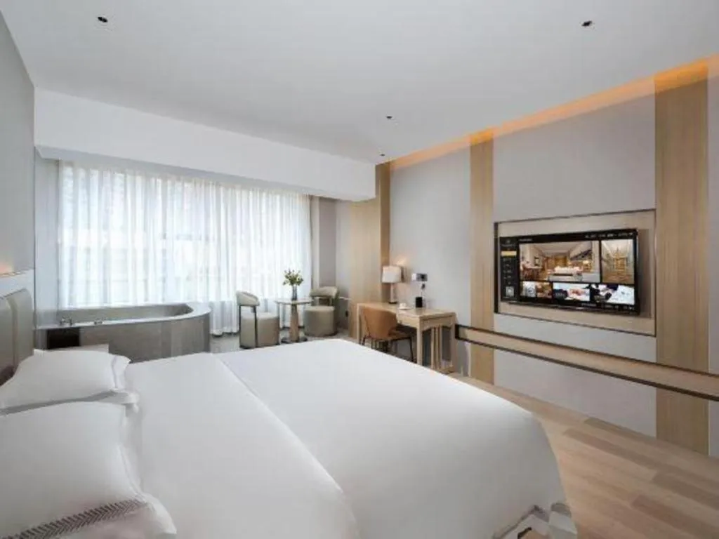 Bed in Vienna Hotel Yunnan Maitreya Huquan