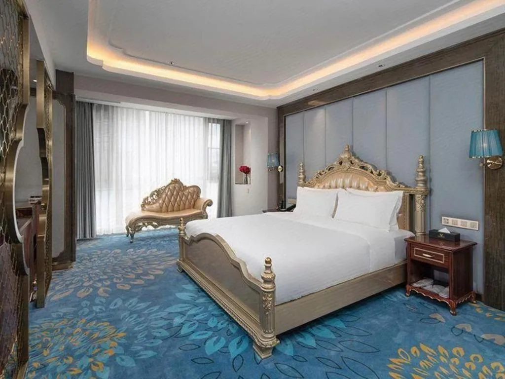 Bed in Vienna Hotel Yunnan Maitreya Huquan