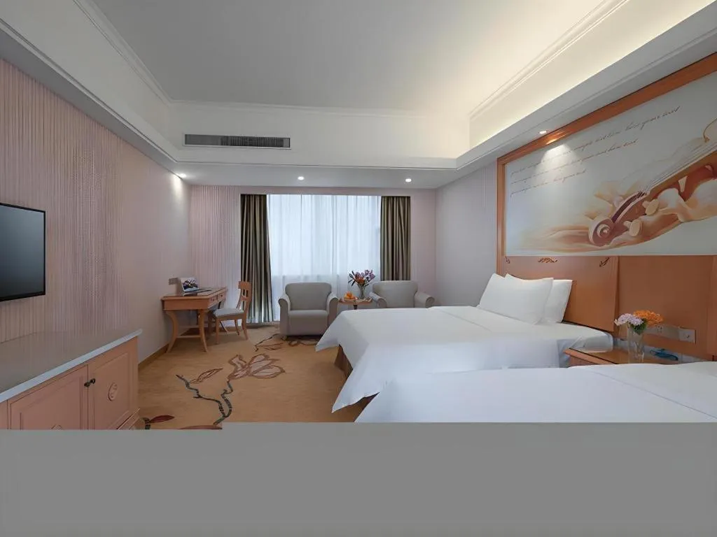 Bed in Vienna Hotel Hubei Macheng Cultural Town