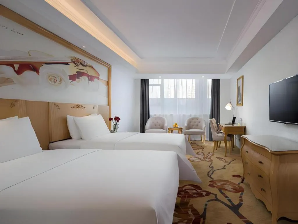 Bed in Vienna Hotel Guangdong Huizhou Huabianling Square