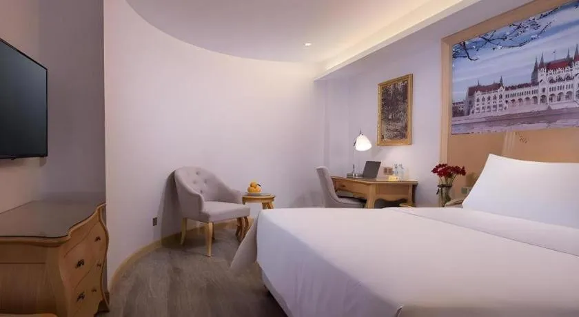 Bed in Vienna Hotel Guangdong Huizhou Huabianling Square