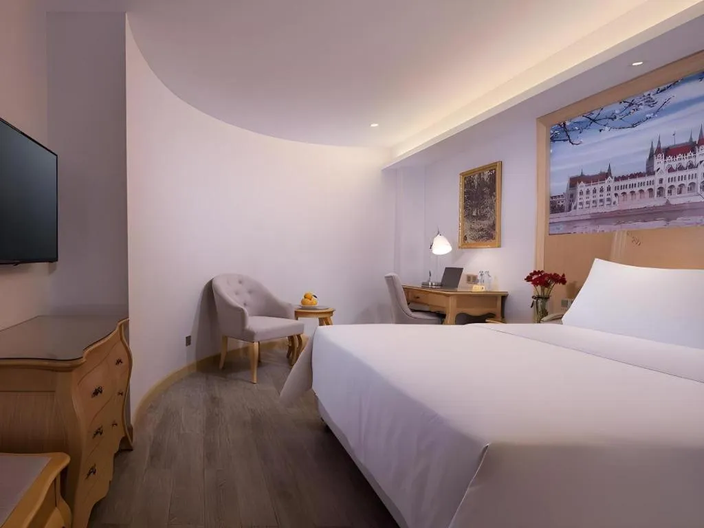 Bed in Vienna Hotel Guangdong Huizhou Huabianling Square