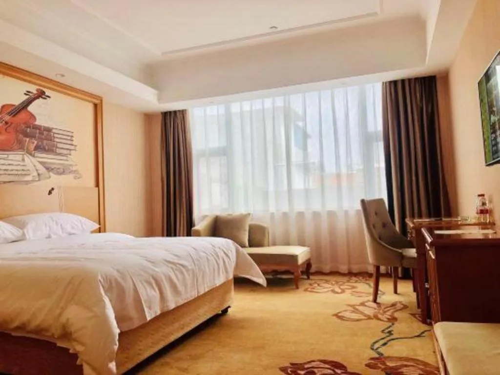 Bed in Vienna Hotel Guangxi Yulin Rong County Guinan Road