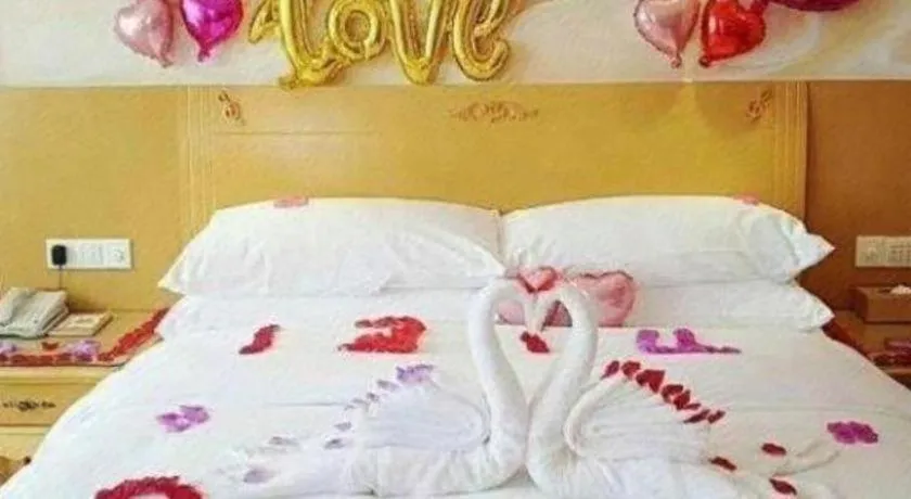 Bed in Vienna Hotel Guangxi Yulin Rong County Guinan Road