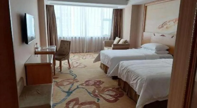 Bed in Vienna Hotel Guangxi Yulin Rong County Guinan Road