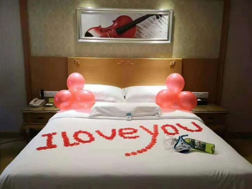 Bed in Vienna Hotel Guangxi Yulin Rong County Guinan Road