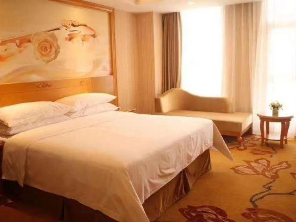 Bed in Vienna Hotel Guangxi Yulin Rong County Guinan Road