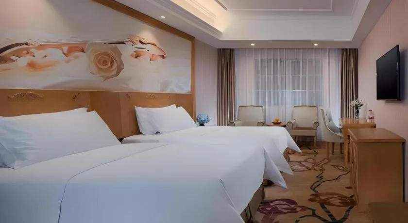 Bed in Vienna Hotel Guangxi Yulin Rong County Guinan Road
