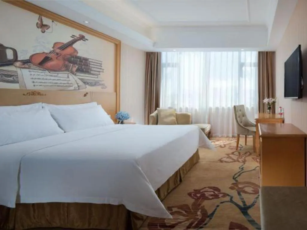 Bed in Vienna Hotel Guangxi Yulin Rong County Guinan Road