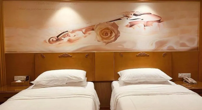 Bed in Vienna Hotel Guangxi Yulin Rong County Guinan Road
