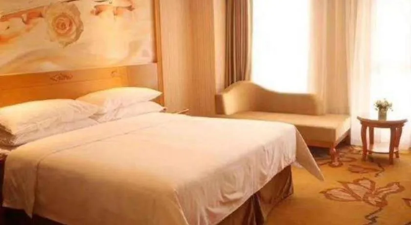 Bed in Vienna Hotel Guangxi Yulin Rong County Guinan Road
