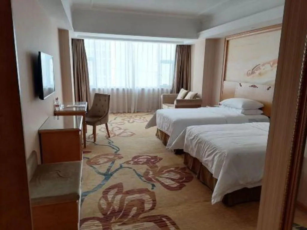 Bed in Vienna Hotel Guangxi Yulin Rong County Guinan Road
