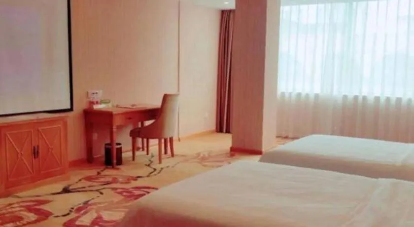 Bed in Vienna Hotel Guangxi Yulin Rong County Guinan Road