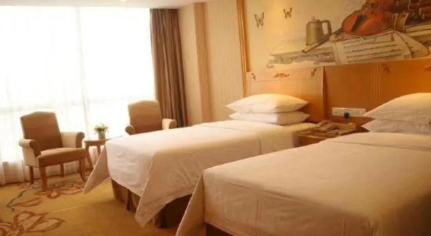 Bed in Vienna Hotel Guangxi Yulin Rong County Guinan Road