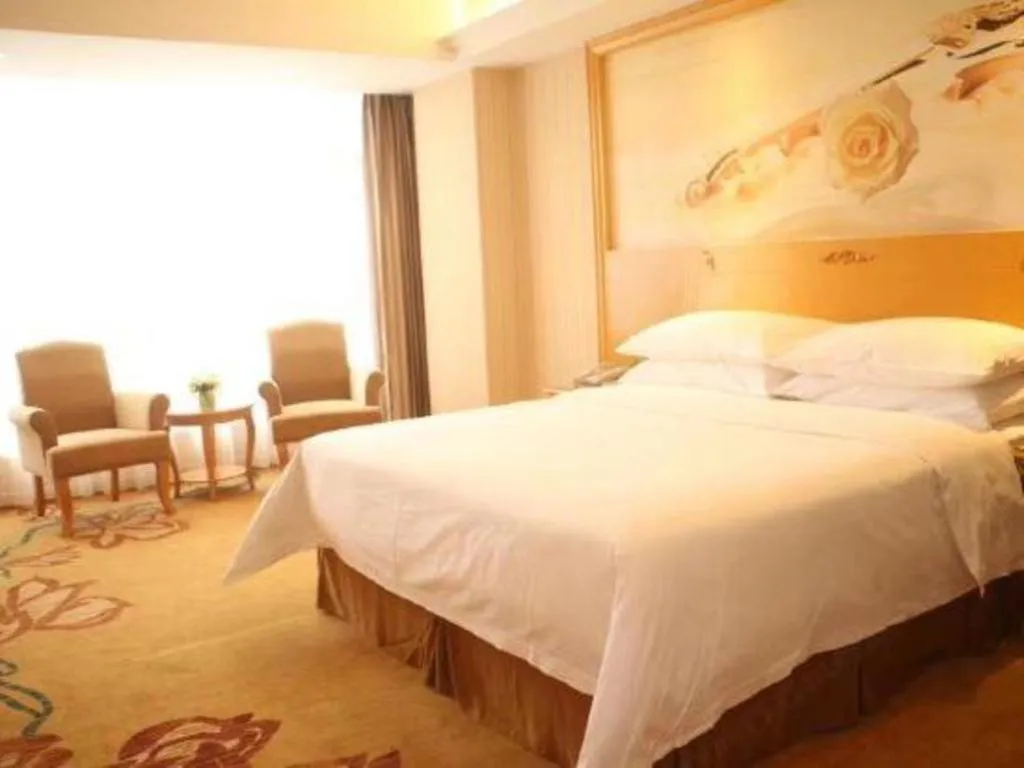 Bed in Vienna Hotel Guangxi Yulin Rong County Guinan Road