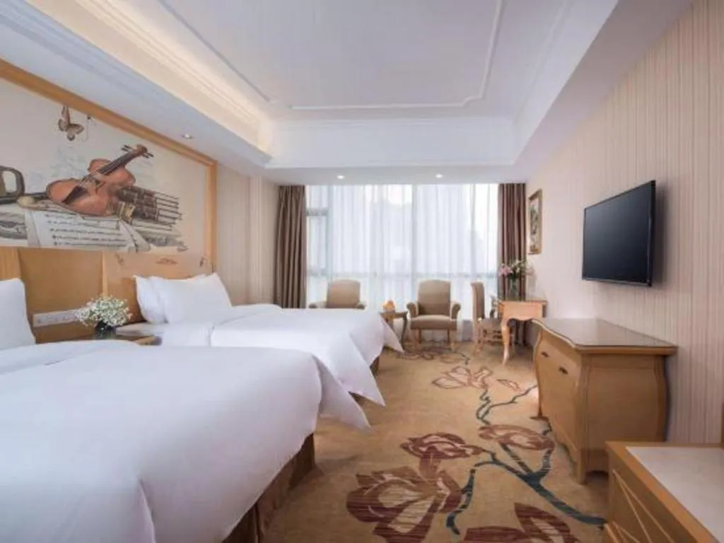 Bed in Vienna Hotel Guangxi Yulin Rong County Guinan Road
