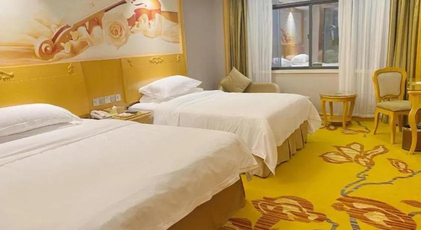 Bed in Vienna Hotel Guangxi Fangcheng