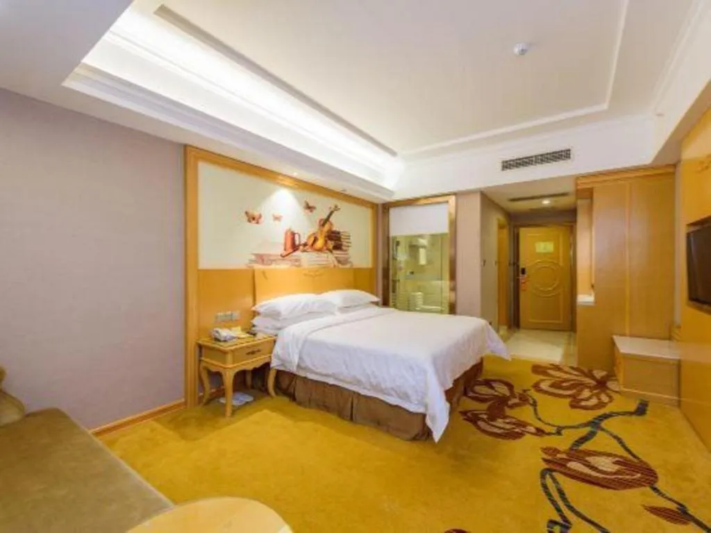 Bed in Vienna Hotel Guangxi Fangcheng