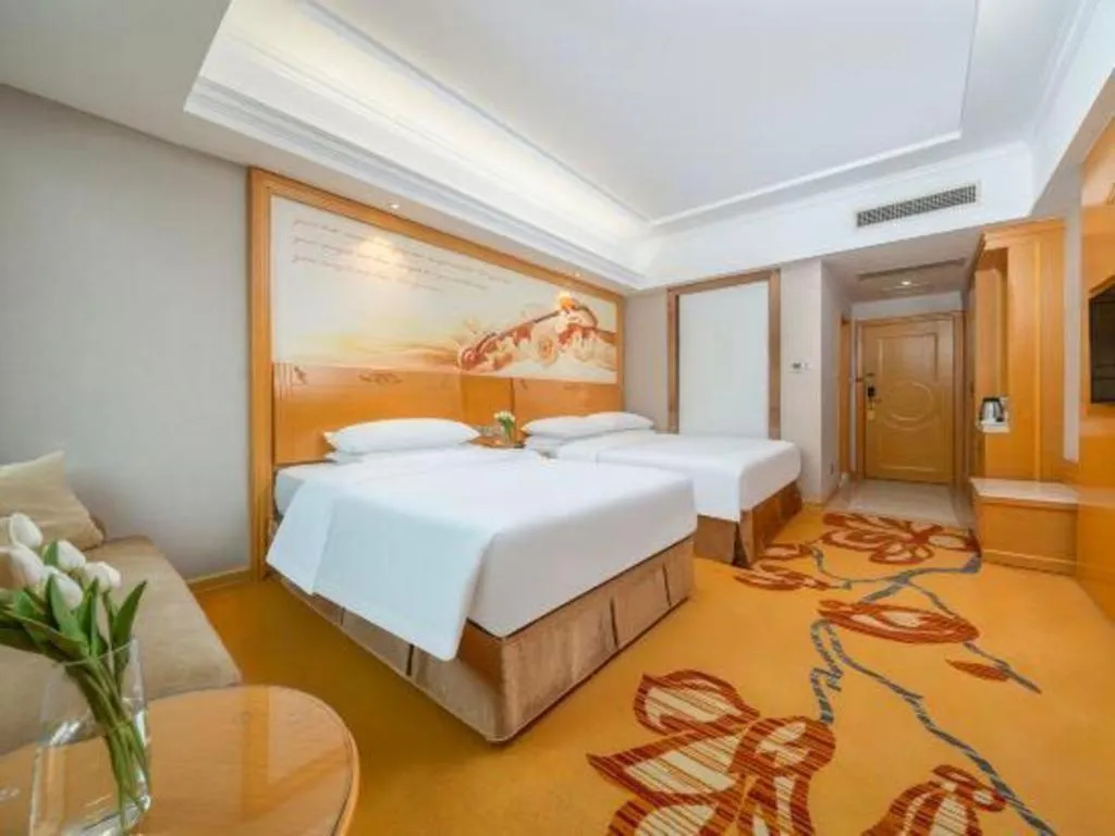 Bed in Vienna Hotel Guangxi Fangcheng