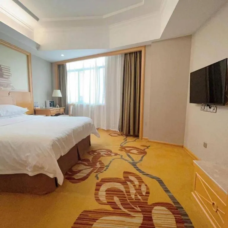 Bed in Vienna Hotel Guangxi Fangcheng