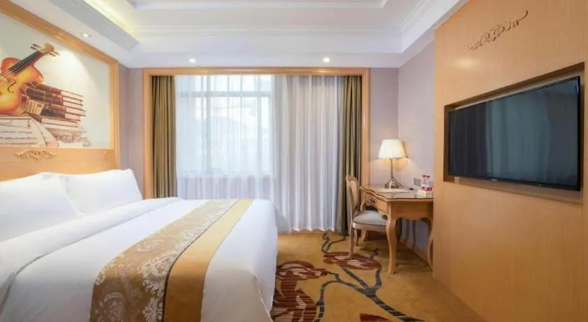 Bed in Vienna Hotel Guangxi Fangcheng