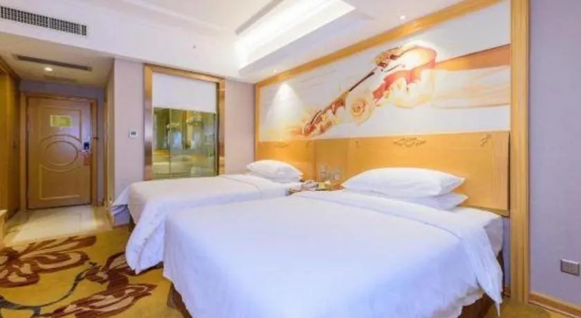 Bed in Vienna Hotel Guangxi Fangcheng