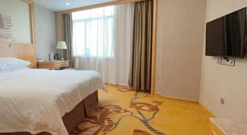 Bed in Vienna Hotel Guangxi Fangcheng