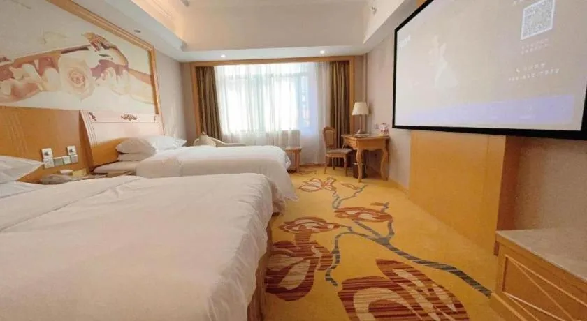 Bed in Vienna Hotel Guangxi Fangcheng