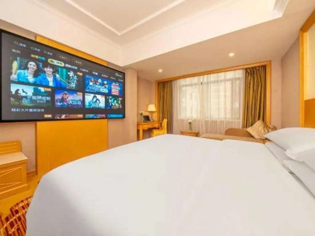 Bed in Vienna Hotel Guangxi Fangcheng