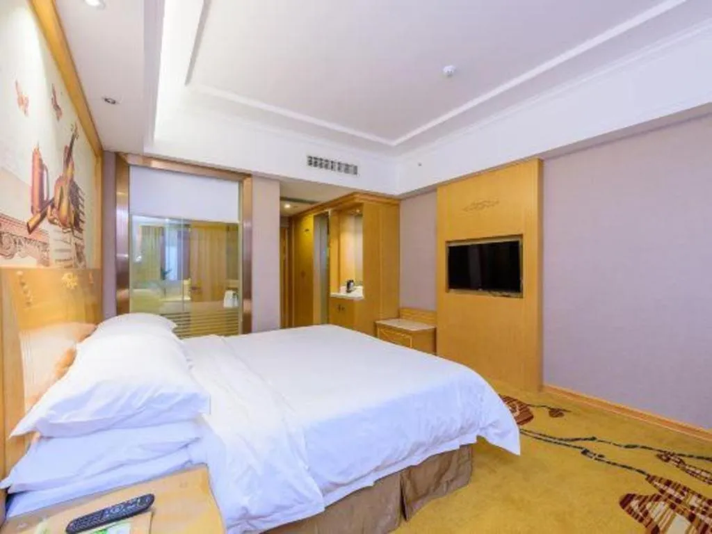 Bed in Vienna Hotel Guangxi Fangcheng