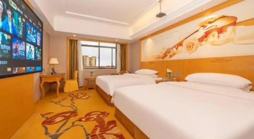 Bed in Vienna Hotel Guangxi Fangcheng