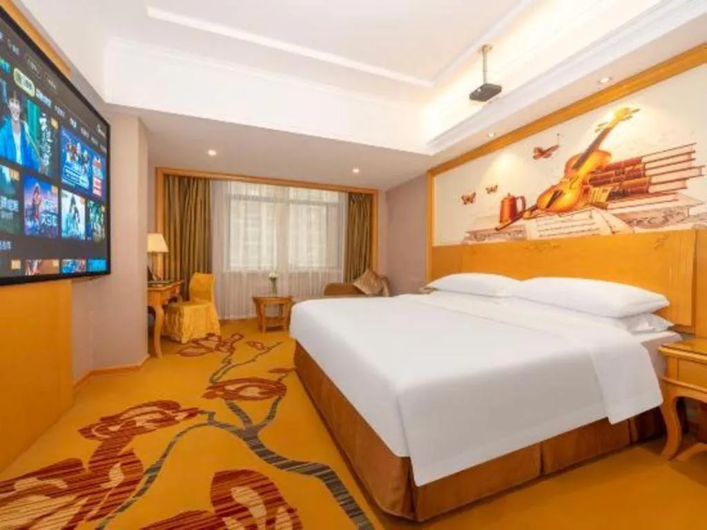 Bed in Vienna Hotel Guangxi Fangcheng