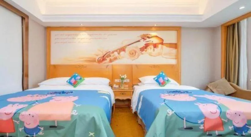 Bed in Vienna Hotel Guangxi Fangcheng