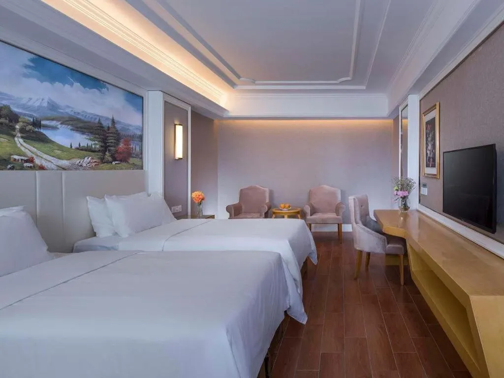 Bed in Vienna Hotel Shenzhen Pingdi Huancheng South Road