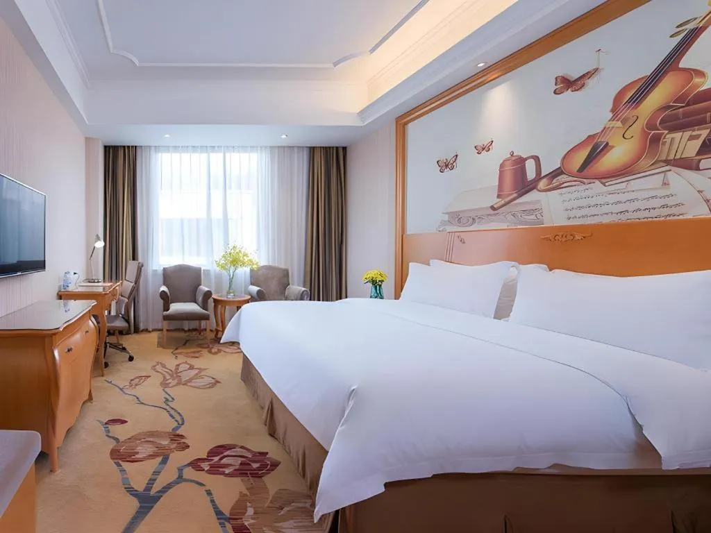 Bed in Vienna Hotel Shenzhen Pingdi Huancheng South Road