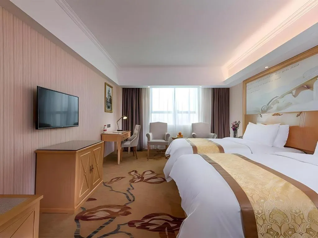 Bed in Vienna Hotel Shenzhen Pingdi Huancheng South Road